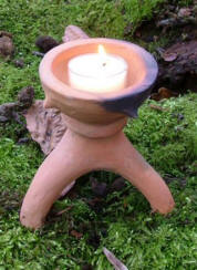 Three-legged candle holder
